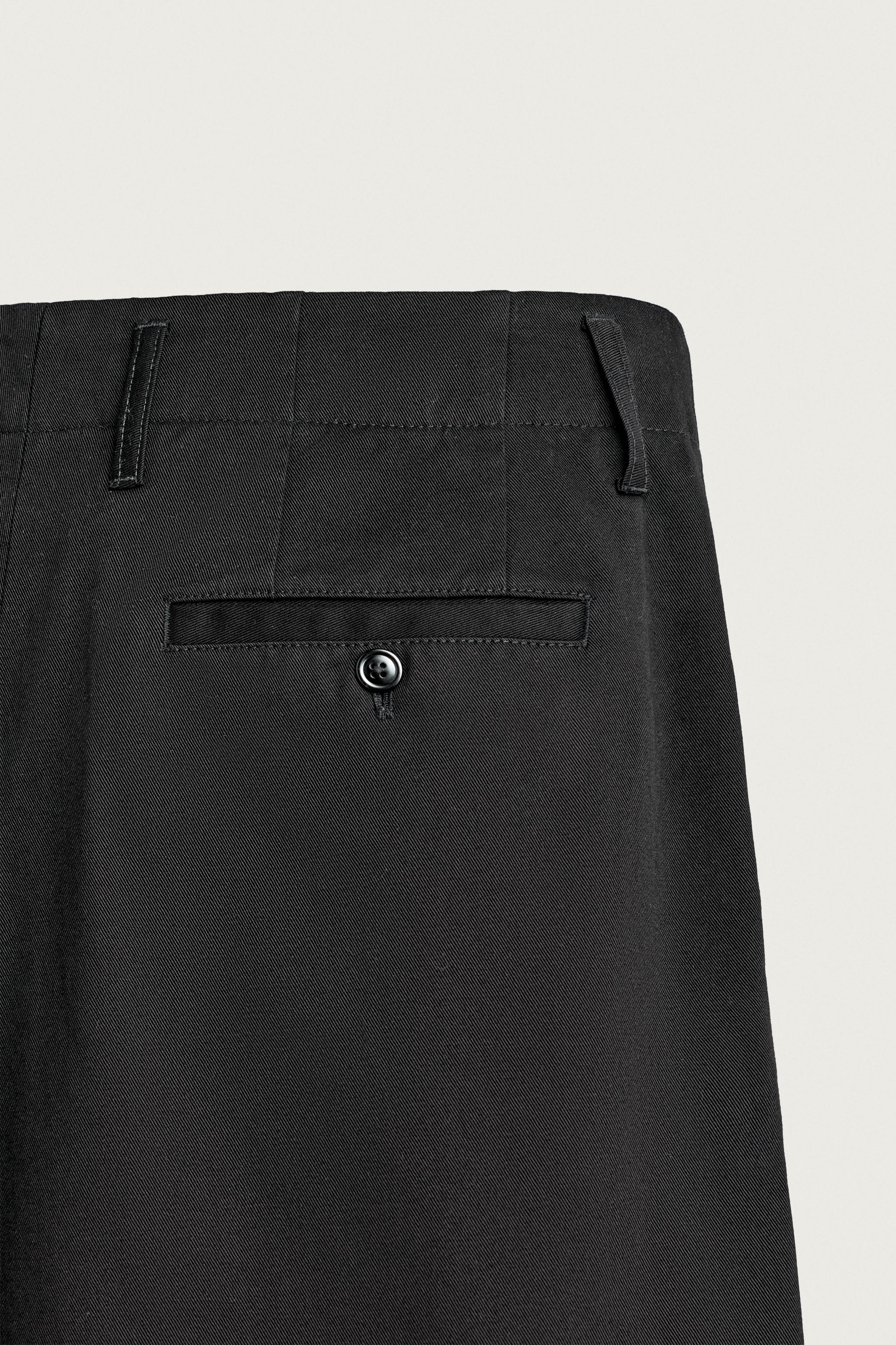 RELAXED FIT PLEATED CHINO PANTS